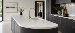 Curved white Corian kitchen island with seamless integrated sink